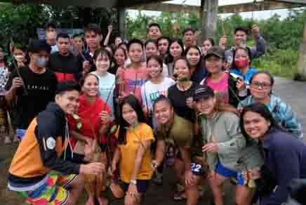 YOUTHS of Del Carmen, Surigao del Norte participate in a tree-planting to expand the mangrove forest cover of Del Carmen Mangrove Boardwalk.
